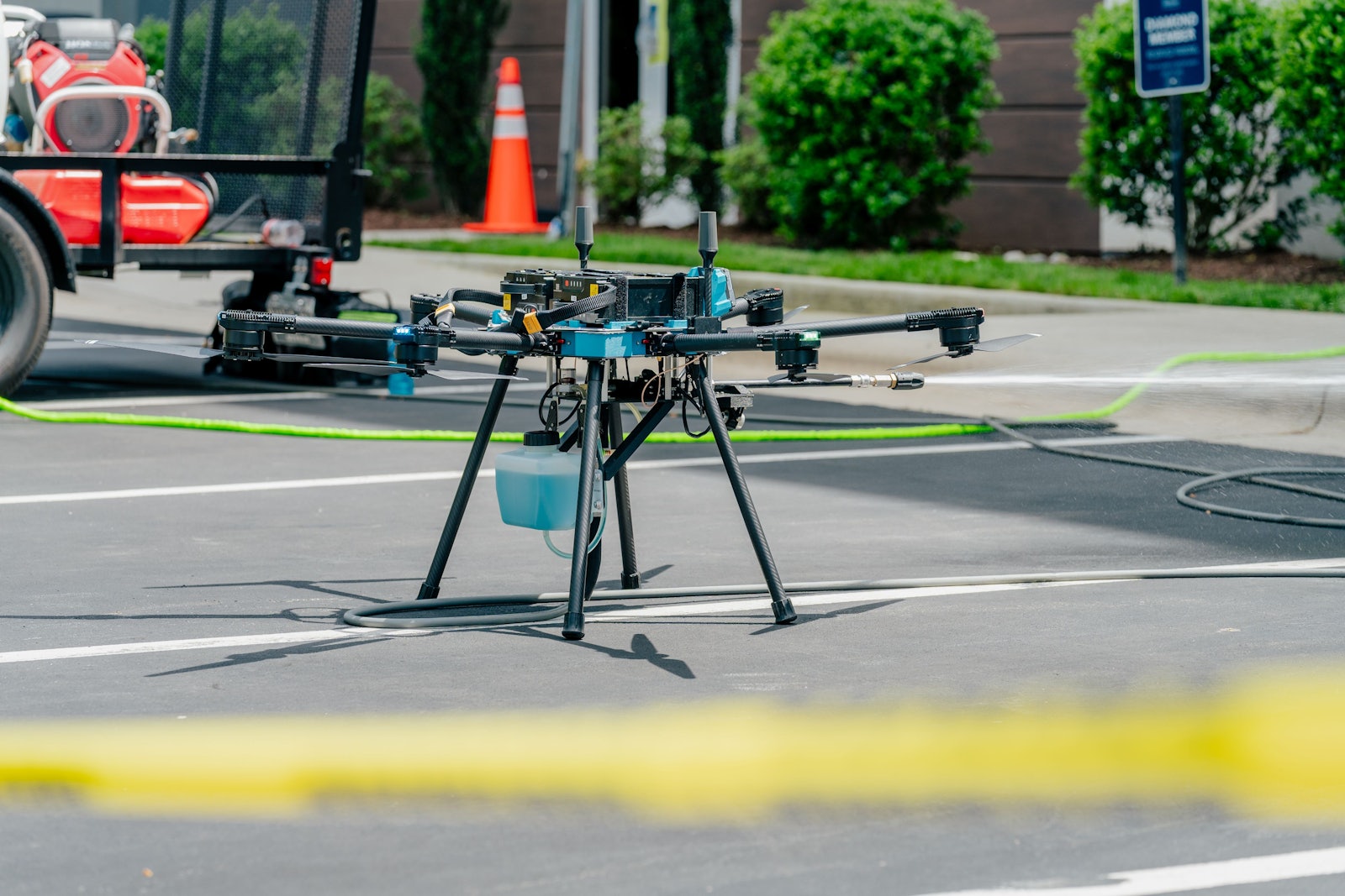 Sherpa drone staged in a parking lot with ground support equipment