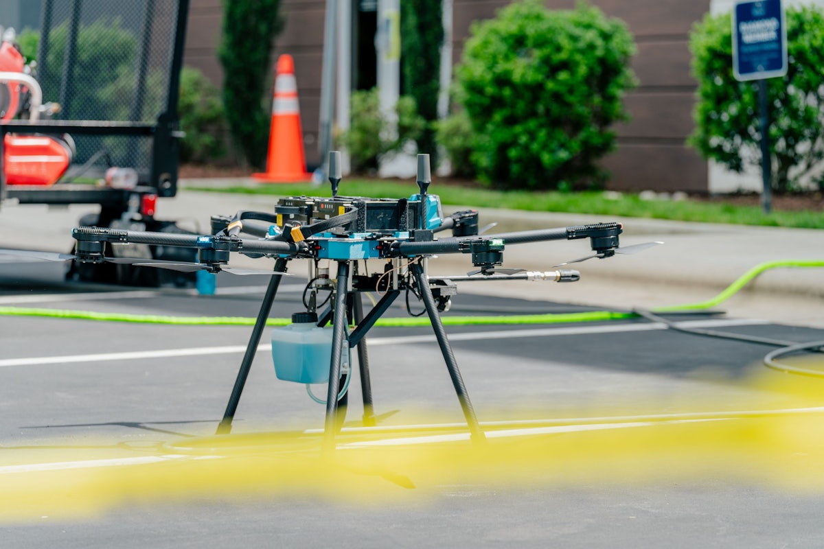 Operator flying the Sherpa cleaning drone on a commercial site
